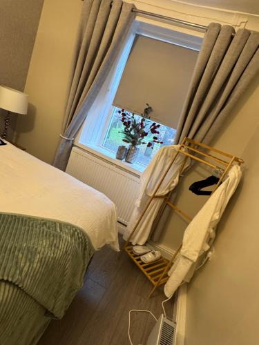 a bedroom with a bed and a window at Church view in Conisbrough
