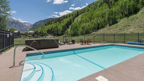 a swimming pool with a view of a mountain at Etta Place Too 103 by AvantStay Close to Town The Slopes In Complex w Communal Pool Hot Tub in Telluride