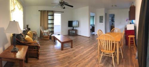 a living room with a couch and a table at The Gray House