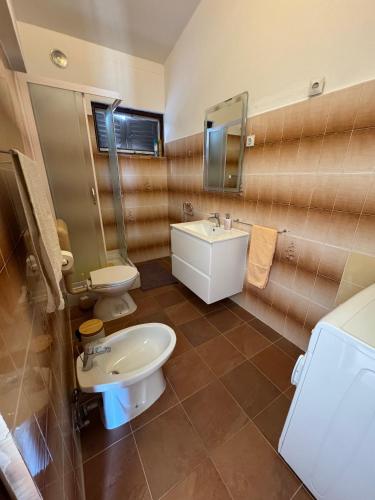 a bathroom with a sink and a toilet at Apartments by the sea Prizba, Korcula - 149 in Prizba