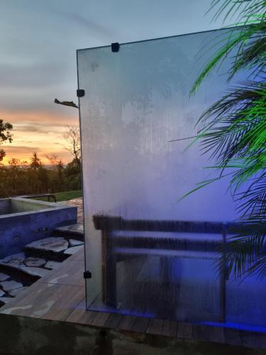 a reflection of a bench in a glass wall at Vista Bella HostHouse 2 in Brasilia