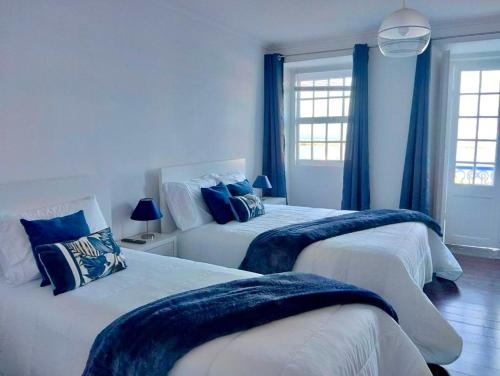 Giường trong phòng chung tại SEASTAR nº36