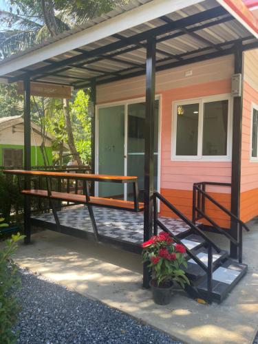 a screened in porch of a tiny house at Vannana House Ko Lanta in Ko Lanta