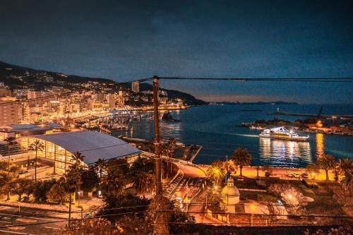 a view of a city with a harbor at night at さざなみハウス熱海 in Atami