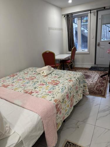 a bedroom with a bed and a table and chairs at park inn in Toronto