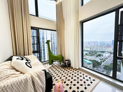 a bedroom with a bed and a large window at Qixin Homestay in Changsha
