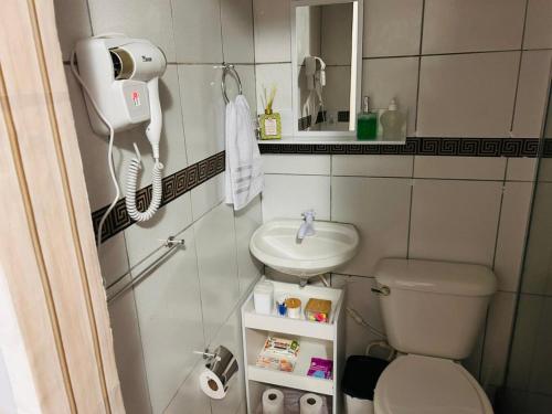 Et badeværelse på Recreio Beach - Suítes - Quarto Família e Quarto coletivo na Gilka Machado