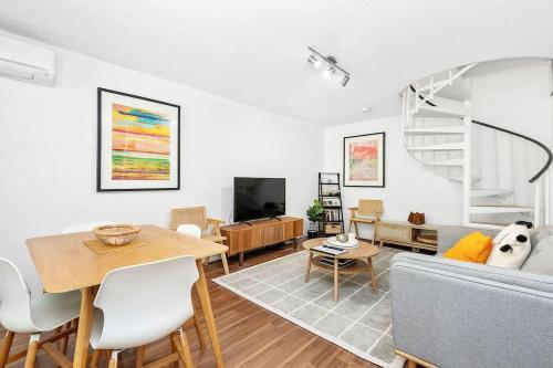 a living room with a couch and a table at 22 Heavenly Highgate 2 Bedrm & Parking-Walk to HBF in Perth