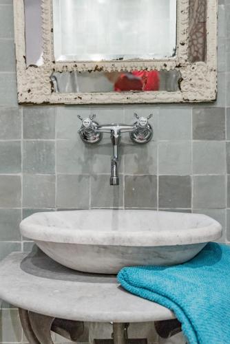 a sink in a bathroom with a window at Romantic Provence Pool & Mill View in Goult