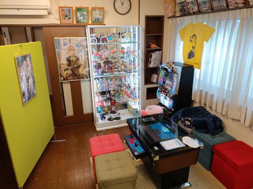 a living room with a room filled with toys at Tiny GuestHouse Umekoji 梅小路 in Kyoto