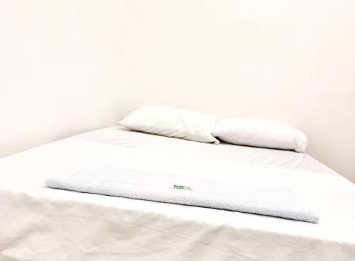 Ein Bett oder Betten in einem Zimmer der Unterkunft Haití Hotel B