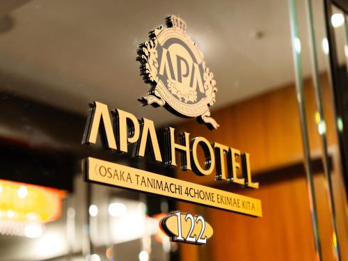Et logo, certifikat, skilt eller en pris der bliver vist frem på APA Hotel Osaka Tanimachi 4chome Ekimae Kita