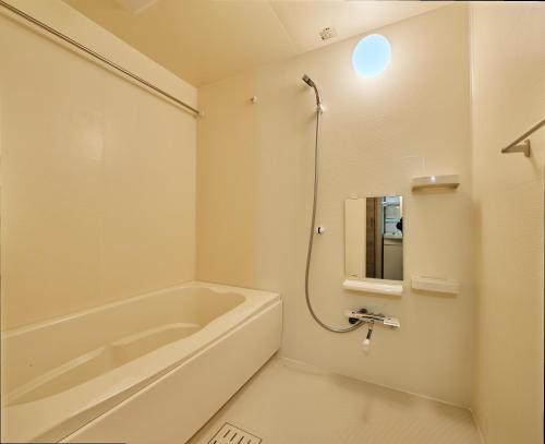 Koupelna v ubytování Living like Hotel 博多駅前