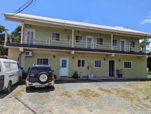 a car parked in front of a house at Jacqueline's Court in Mount Pleasant