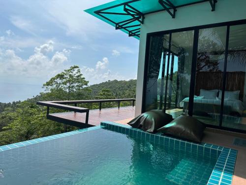 a villa with a swimming pool and a bedroom at Love koh tao villa 2 in Koh Tao