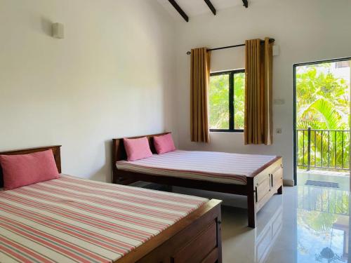 En eller flere senge i et værelse på The Paramount Lodge