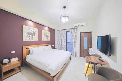 En eller flere senge i et værelse på Starting Point B&B