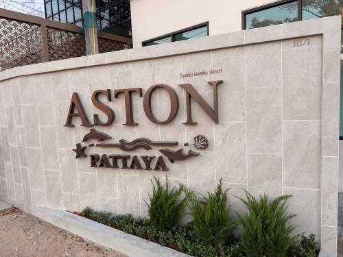 a sign for an asotin apartment building at Aston Hotel Pattaya in Pattaya