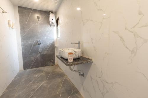 a bathroom with a shower and a sink at Glory of MJ, Family Resort in Nature, Panvel in Panvel