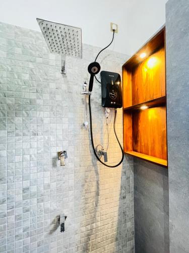 a shower stall in a bathroom with a shower at Sky View in Matara