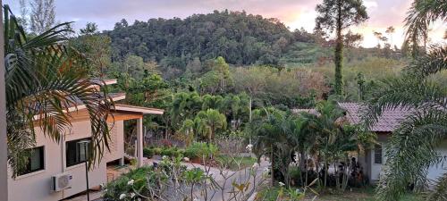 a house with a view of a mountain at Villa Lyn Kai Bae in Khlaung Phai Bae