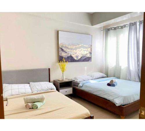 En eller flere senge i et værelse på Rk Property Rentals