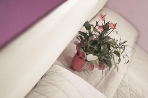
A bed or beds in a room at La Tarantola
