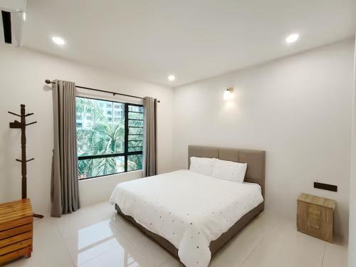 Postel nebo postele na pokoji v ubytování Manhattan Suites Ipoh