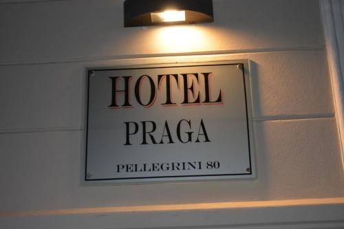a hotel sign on the wall of a room at Hotel Praga in Gualeguaychú