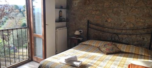 En eller flere senge i et værelse på Agriturismo Campo Ruffaldo