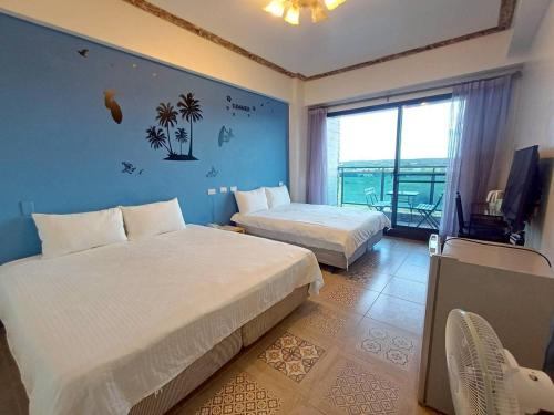 En eller flere senge i et værelse på 墾丁秋莊會館 附限量停車位 不保證有位置 無法事先預留 背包房無車位 預訂後記得加Line聯繫