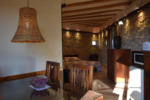 a dining room and living room with a dining table at Casa Cundaro in Girona