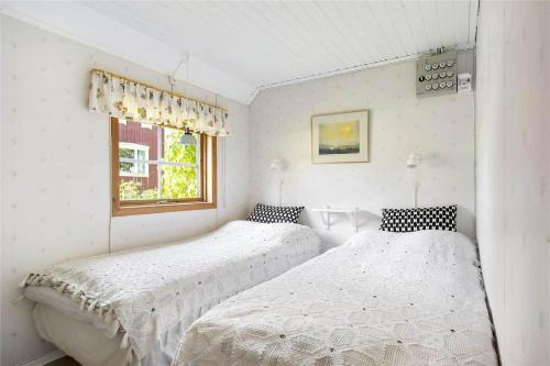 En eller flere senge i et værelse på KRO273-Bolmsoe-Tjust-Lund