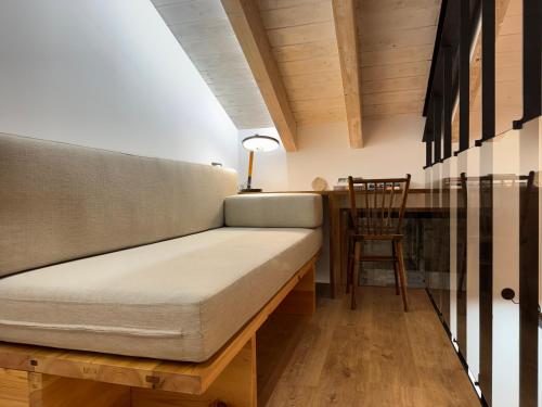 a couch in a room with a table and a chair at Casa Gafura in Noya