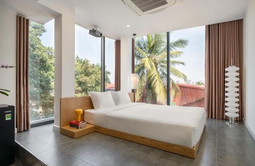 En eller flere senge i et værelse på Bach Plateaus Hotel