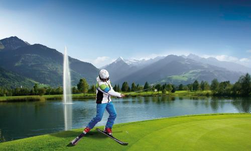 a person on skis playing golf near a lake at Appartement Gimpl in Fusch an der Glocknerstraße