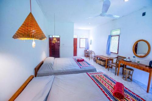 Postel nebo postele na pokoji v ubytování Satwa Elephant Eco Lodge