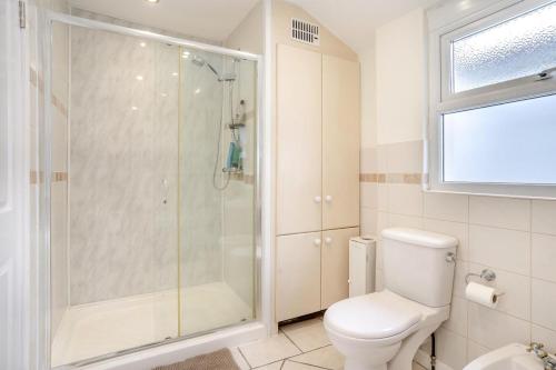 a bathroom with a shower and a toilet at 5 Bed in Mumbles oc-l34618 in The Mumbles