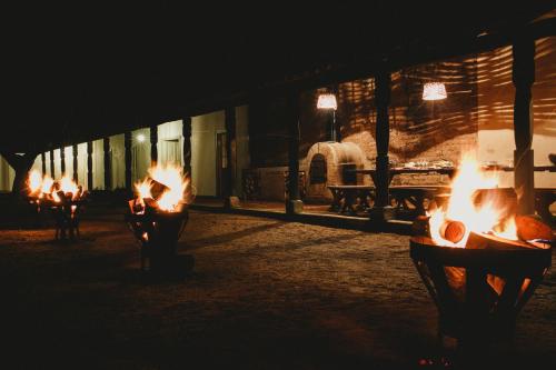 a group of fire burns inside a building at night at Casa Bouchon Hotel Boutique in San Javier