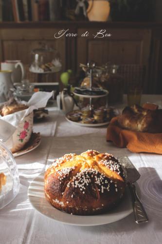 a table with a plate with a pastry on it at B&B Terre Di Bea in Pederobba