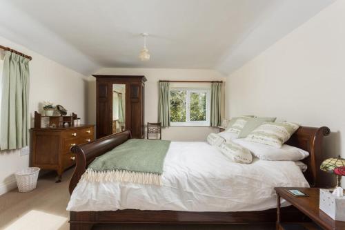 a bedroom with a large bed and a window at 3 Bed in Ampleforth oc-m34673 in Ampleforth