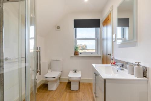 a white bathroom with a toilet and a sink at 2 Bed in Duddlestone oc-q34588 in Duddlestone