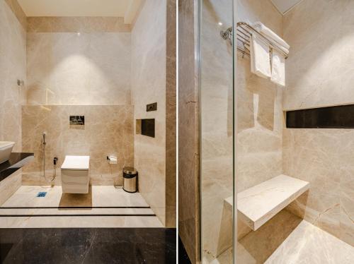 a bathroom with a shower and a sink at CS Luxurio Presendential Suites Gachibowli in Hyderabad