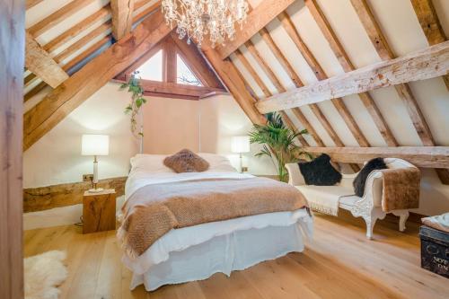 a bedroom with a large bed in a attic at 3 Bed in Dulas oc-g34082 in Longtown