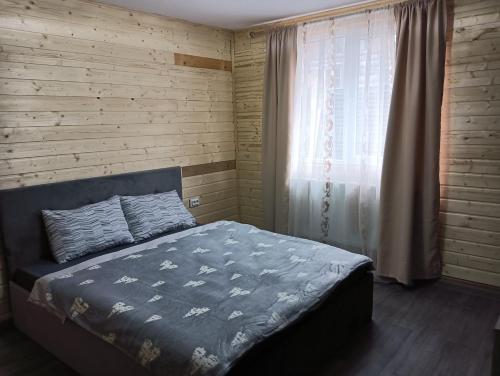 Llit o llits en una habitació de Casuta DM