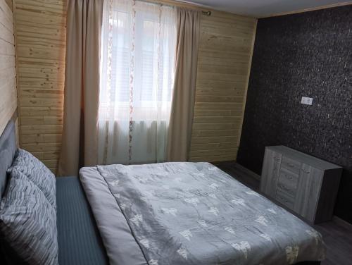 En eller flere senge i et værelse på Casuta D&M