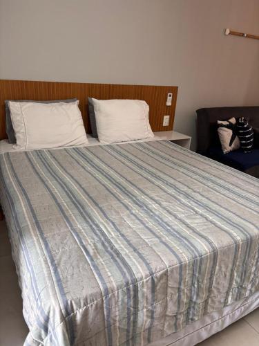 En eller flere senge i et værelse på Flat Centro Barra Grande