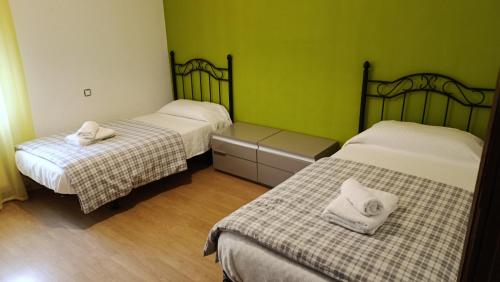 En eller flere senge i et værelse på Casa Ambite