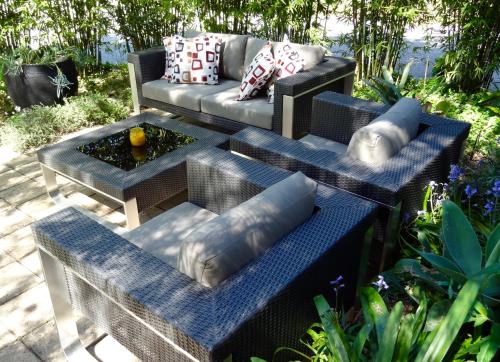 a patio with a couch and a table with pillows at The Gallery Accommodation McCrae in McCrae
