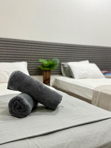 a towel animal sitting on top of a bed at Reinforce Residence in Thulusdhoo